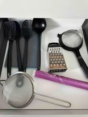 a group of kitchen utensils sitting on a counter at Cozy apartment in a new building apartment 2 in Piraeus