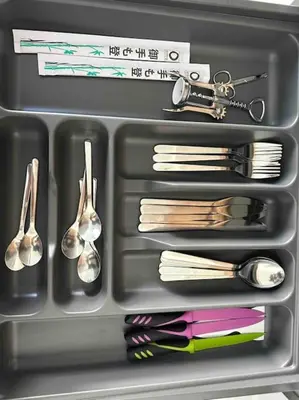 a lunch box with utensils and spoons at Cozy apartment in a new building apartment 4 in Piraeus