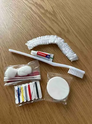 a group of toothbrushes and toothpaste on a table at Cozy apartment in a new building apartment 4 in Piraeus