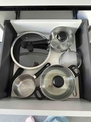 a drawer filled with lots of pots and pans at Cozy apartment in a new building apartment 4 in Piraeus