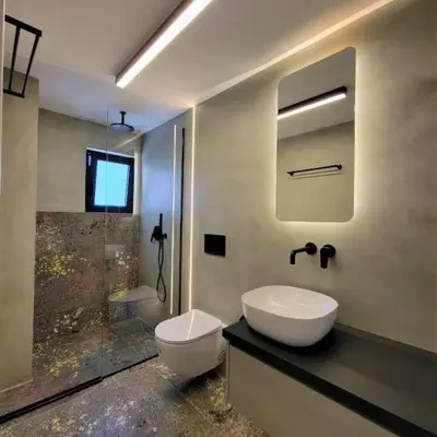 a bathroom with a sink and a toilet and a shower at BlueMotion - CruiseNest 143 5B in Piraeus