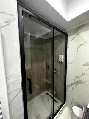 a shower with a glass door in a bathroom at Cozy Elegant Residence #1 VIPGreece in Athens
