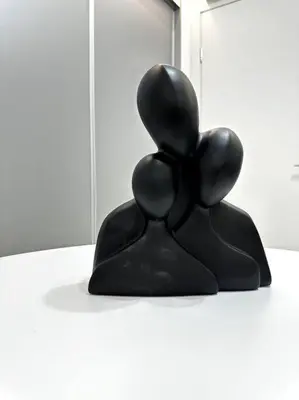 a black sculpture of a teddy bear on a counter at Cozy Elegant Residence #1 VIPGreece in Athens