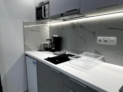 a kitchen with a sink and a counter top at Cozy Elegant Residence #1 VIPGreece in Athens