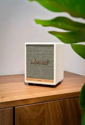 a small radio sitting on top of a wooden table at LuxSuite by Voula & Glyfada beach in Athens