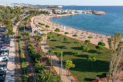 a view of a beach and the ocean at LuxSuite by Voula & Glyfada beach in Athens