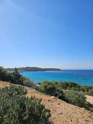 a view of the ocean from the top of a hill at LuxSuite by Voula & Glyfada beach in Athens