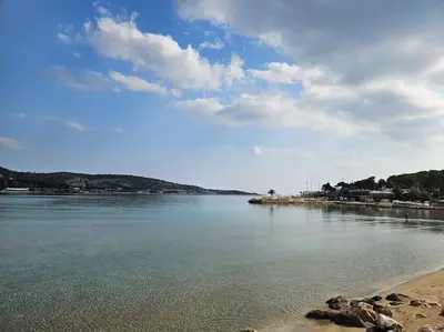 a view of a body of water with a beach at LuxSuite by Voula & Glyfada beach in Athens
