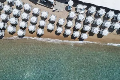 an aerial view of the beach and the ocean at LuxSuite by Voula & Glyfada beach in Athens