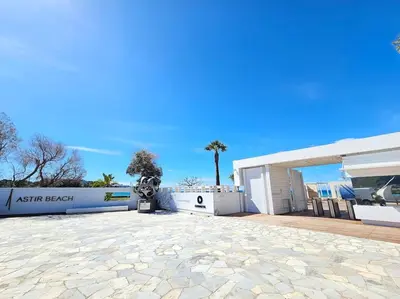 a building with a stone driveway in front of it at LuxSuite by Voula & Glyfada beach in Athens
