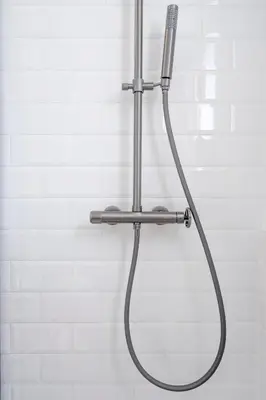 a shower with a shower head in a bathroom at Voula Panoramic Terraces - Greecing in Athens