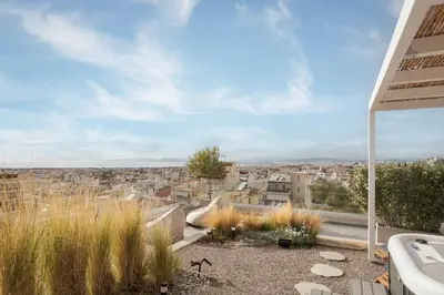 a bathroom with a view of a city at Glyfada Panoramic Penthouse in Athens