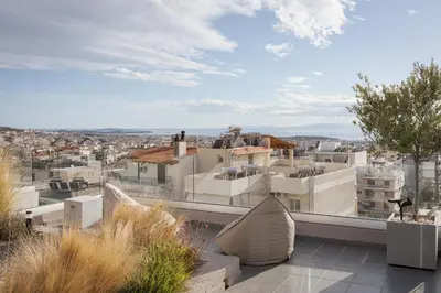 a view of a city from the balcony of a building at Glyfada Panoramic Penthouse in Athens