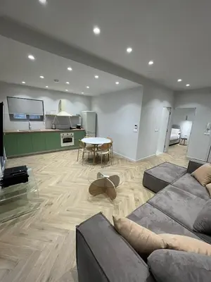 a living room with a couch and a table at Down Town Nea Smyrni in Athens