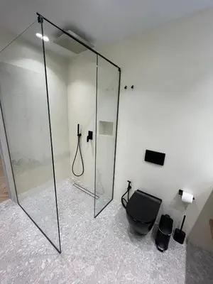 a bathroom with a glass shower and a toilet at Down Town Nea Smyrni in Athens