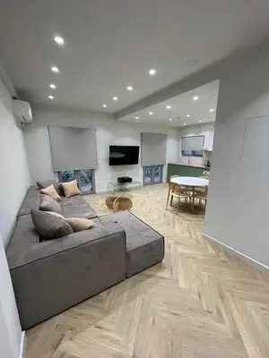 a large living room with a couch and a table at Down Town Nea Smyrni in Athens