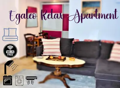 a living room with a couch and a table with food on it at Egaleo Relax Apartment in Athens