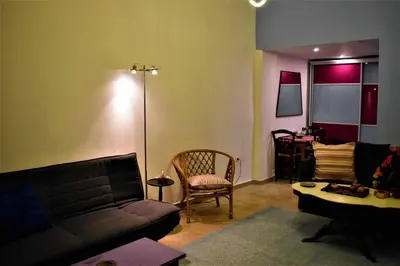 a living room with a couch and a chair at Egaleo Relax Apartment in Athens