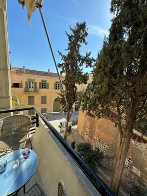 a patio with a table and chairs on a balcony at Plaka K15 in Athens