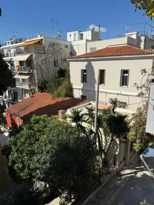 an overhead view of a city with buildings and trees at Plaka K15 in Athens