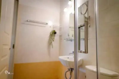 a bathroom with a shower and a sink and a toilet at Aphrodite - Cozy & Bright Studio in Egaleo-Athens in Athens