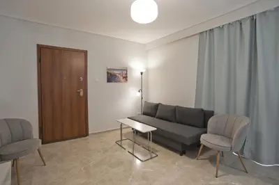 a living room with a couch and two chairs at Belle Helene Luxury, Fully Reno, Athenian Riviera in Athens