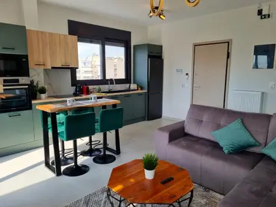 a living room with a couch and a table at 10 Apartments & Suites Athens in Athens