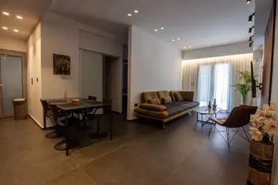 a living room with a couch and a table at Carmen's cozy&luxury apartment! in Athens
