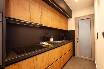 a kitchen with a stove and a counter top at Carmen's cozy&luxury apartment! in Athens