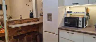a kitchen with a white refrigerator and a microwave at Dimelli's Home in Athens - Comfort & Style Stay in Athens