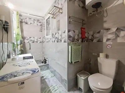 a small bathroom with a toilet and a sink at Dimelli's Home in Athens - Comfort & Style Stay in Athens