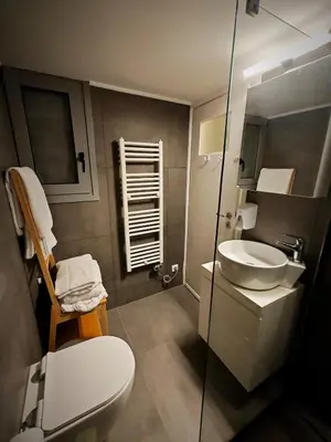 a bathroom with a toilet and a sink at Caravin Wanderhome Acropolis, 1 min from Acropolis Museum in Athens