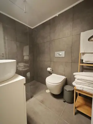 a bathroom with a toilet and a sink at Caravin Wanderhome Acropolis, 1 min from Acropolis Museum in Athens