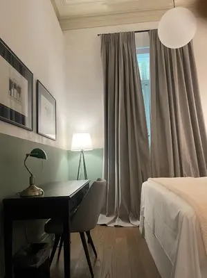 a bedroom with a desk and a bed and a window at Magnificent Athens Apartment 1 Bedroom Apartment Aldoron City View in Athens