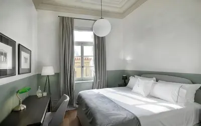 a bedroom with a bed with a desk and a window at Magnificent Athens Apartment 1 Bedroom Apartment Aldoron City View in Athens