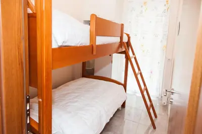 a bunk bed in a room with a bunk bed in a room at Anastasia apts Athina in Athens