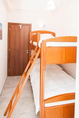 a bunk bed with two bunk beds in a room at Anastasia apts Athina in Athens