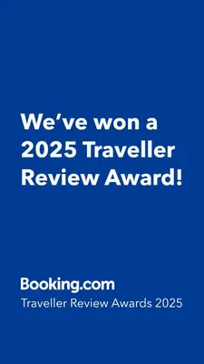 a blue sign that says weve won a traveler review award at Sunny Athens in Athens