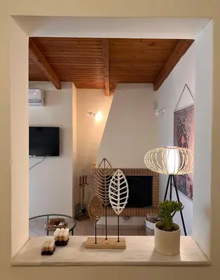a living room with a couch and a table at Sunny Athens in Athens