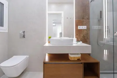 a bathroom with a sink and a toilet and a shower at Magnificent Riviera Residence VIPGreece in Athens