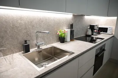 a kitchen with a sink and a counter top at Classy and stylish flat near Pagrati region (D2) in Athens