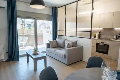 a living room with a couch and a table at Classy and stylish flat near Pagrati region (D2) in Athens