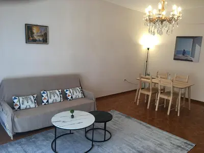 a living room with a couch and a table at \u6d77\u5929\u4e4b\u84dd in Athens
