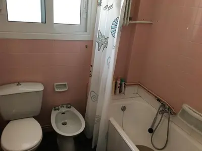 a bathroom with a toilet and a tub and a sink at \u6d77\u5929\u4e4b\u84dd in Athens