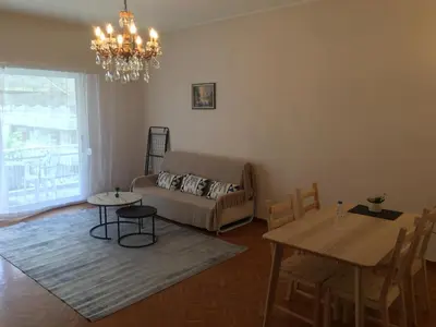 a living room with a couch and a table at \u6d77\u5929\u4e4b\u84dd in Athens