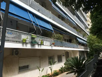 an apartment building with a balcony with plants on it at \u6d77\u5929\u4e4b\u84dd in Athens
