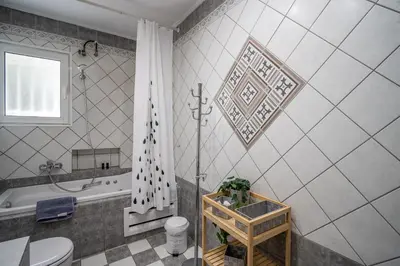 a bathroom with a shower and a toilet and a sink at ANGEL , Luxury 2BD apartment next to the Beach in Athens
