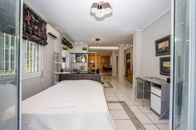 a bedroom with a large white bed in a room at ANGEL , Luxury 2BD apartment next to the Beach in Athens
