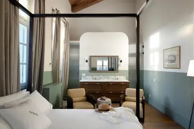a bedroom with a bed and a vanity and a mirror at Luxury Athens Apartment 2 Bedrooms Apartment Mavis Spacious in Athens