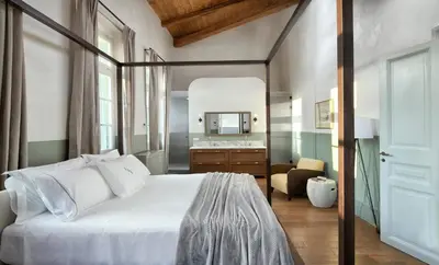 a bedroom with a large white bed and a bathroom at Luxury Athens Apartment 2 Bedrooms Apartment Mavis Spacious in Athens